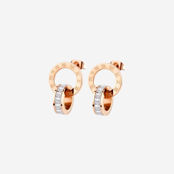 Rose gold hoop earrings with embedded diamonds on a white background