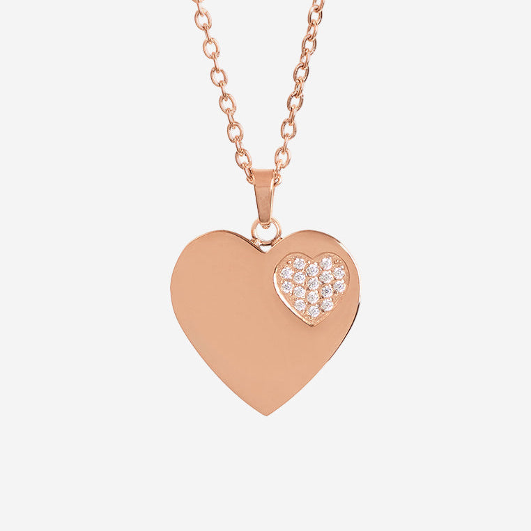 Rose gold heart-shaped necklace with a smaller heart pendant on a white background