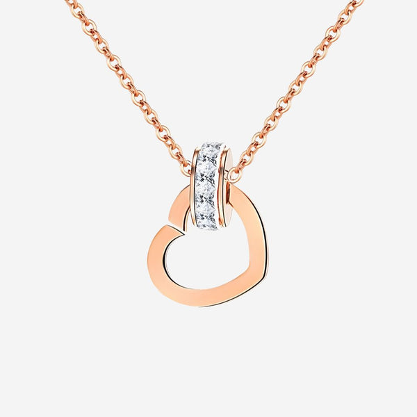 Rose gold necklace with a circular pendant on a white background