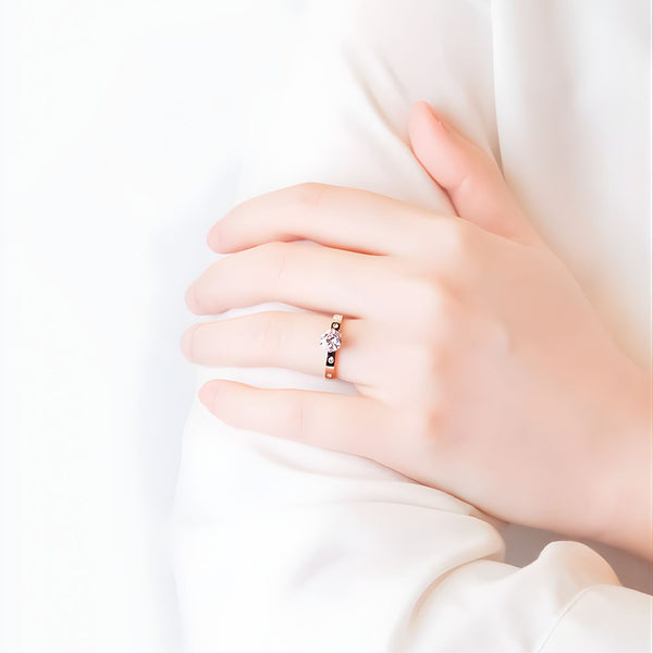 Hand wearing a ring with a white background