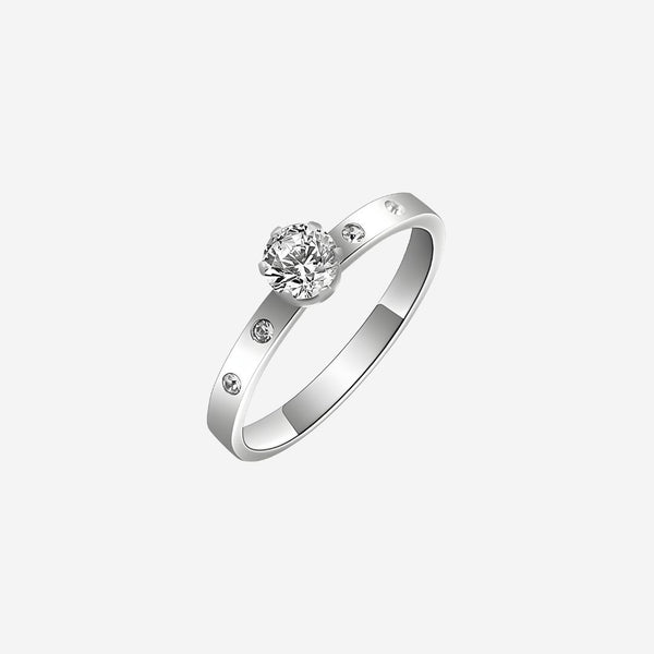 Silver ring with a central diamond and smaller diamonds on the band against a white background