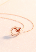 Artemis Interlocking Roman Numeral Ring Necklace